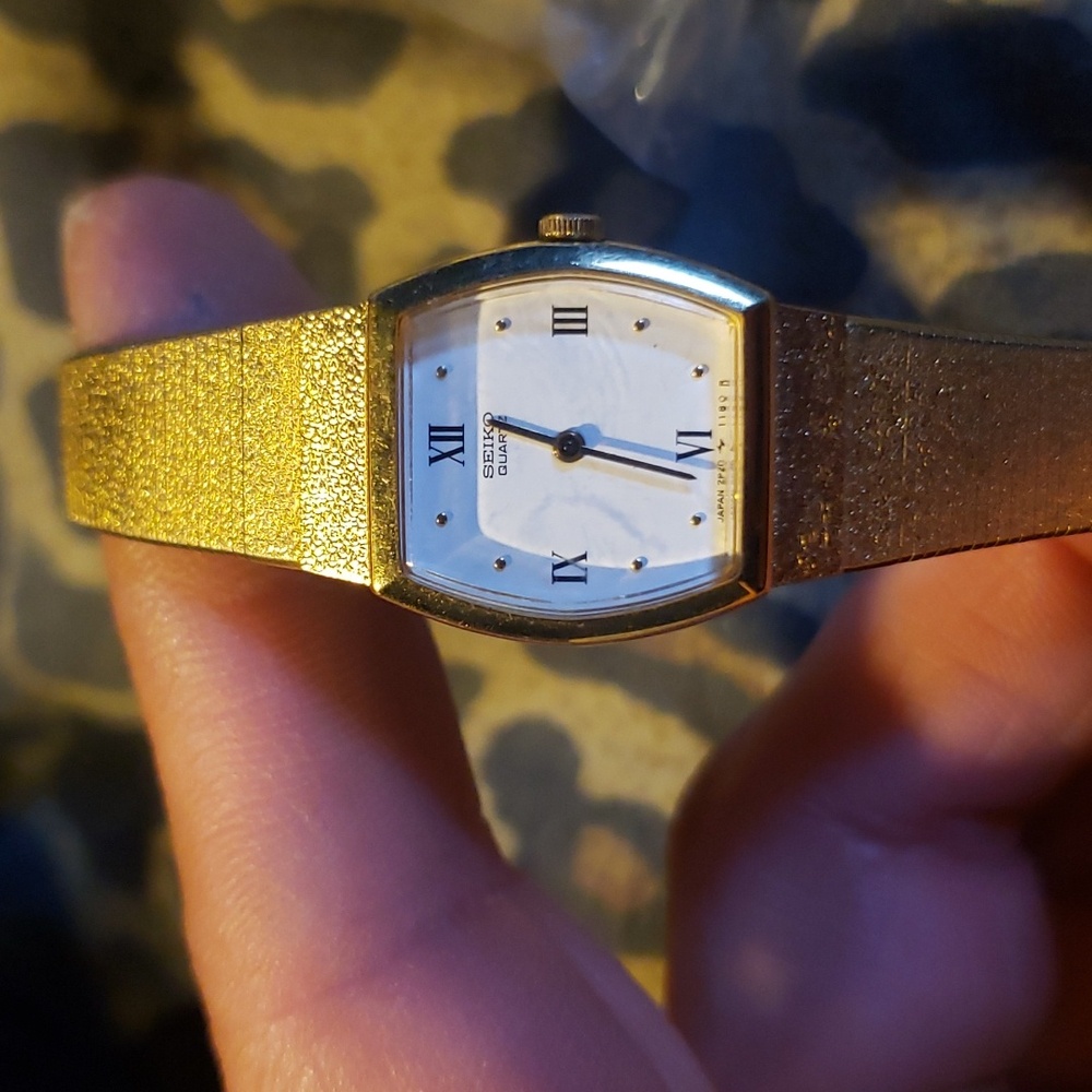 Vintage gold Seiko watch. Has a safety chain.